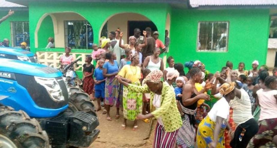 Farmers in Foya celebrate the arrival of a tractor  