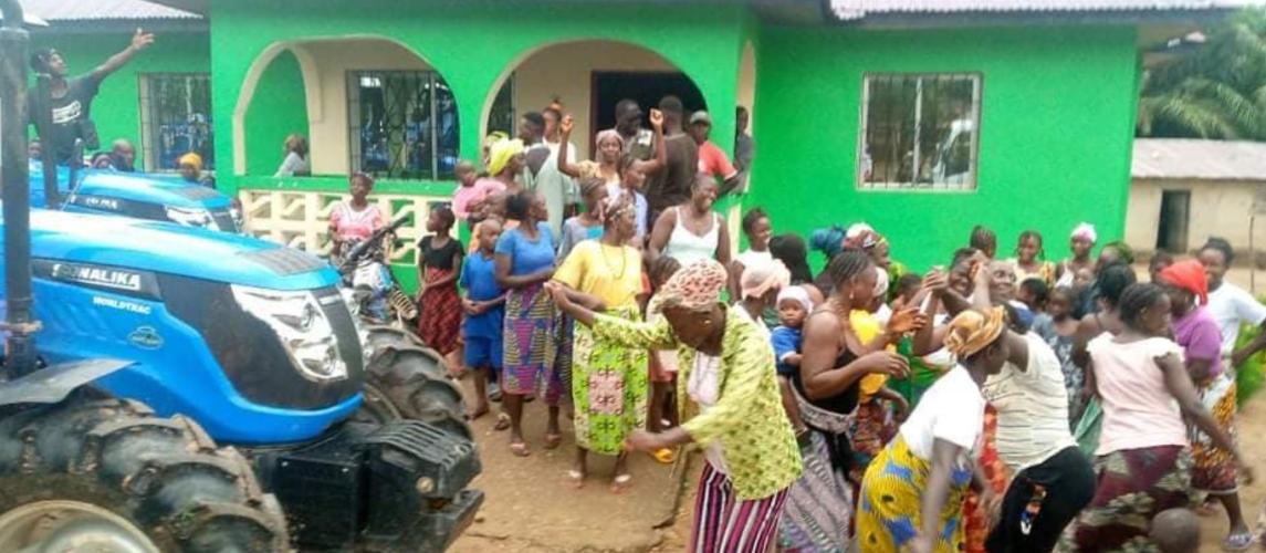 Farmers in Foya celebrate the arrival of a tractor