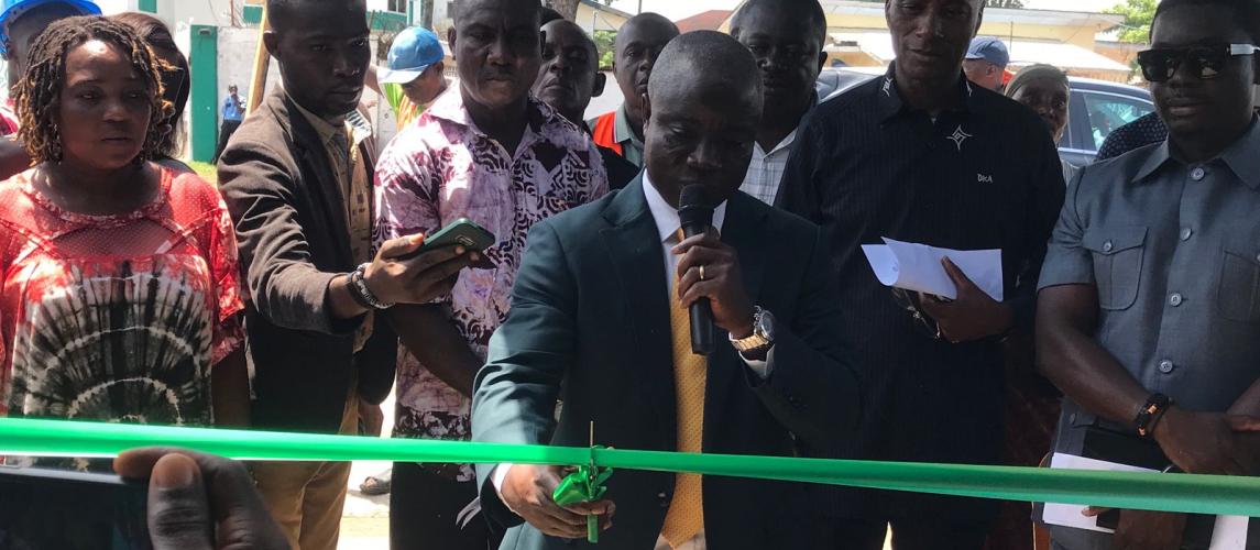 Minister J. Alexander Nuetah, cutting the ribbon at the opening of the vegetable  booth