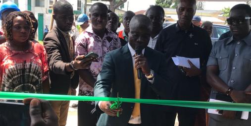 Minister J. Alexander Nuetah, cutting the ribbon at the opening of the vegetable  booth